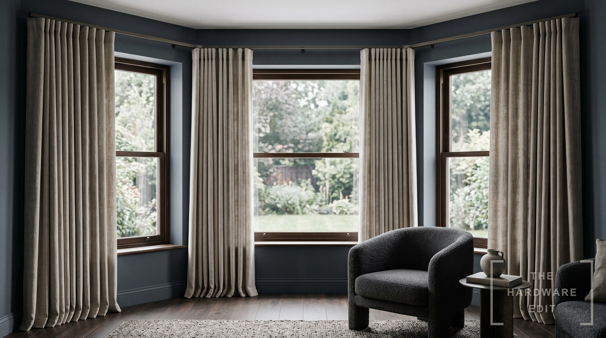 Curtain track bent to follow a bay window
